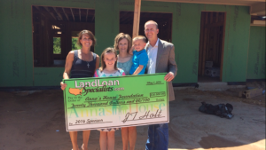 Pictured (left to right) Darci Oplotnik, Executive Director Anna’s House Foundation; Maddie Holt; Mindy Holt; Hudson Holt; and J.T. Holt, CEO Land Loan Specialists.com